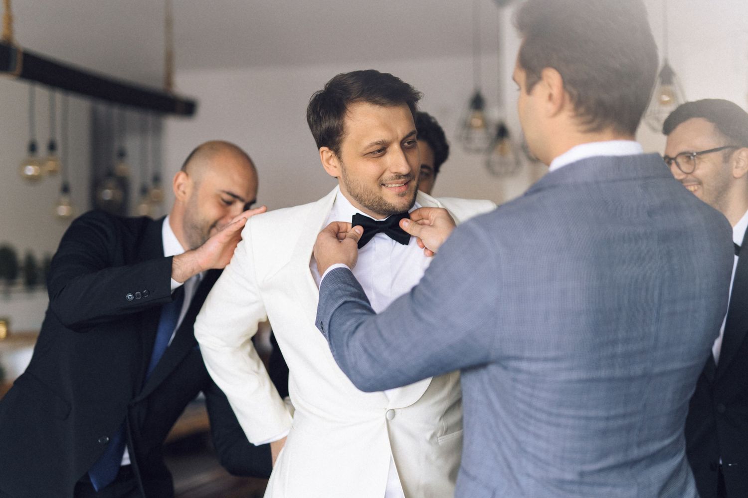 People dancing together in formal attire at an elegant event or celebration.