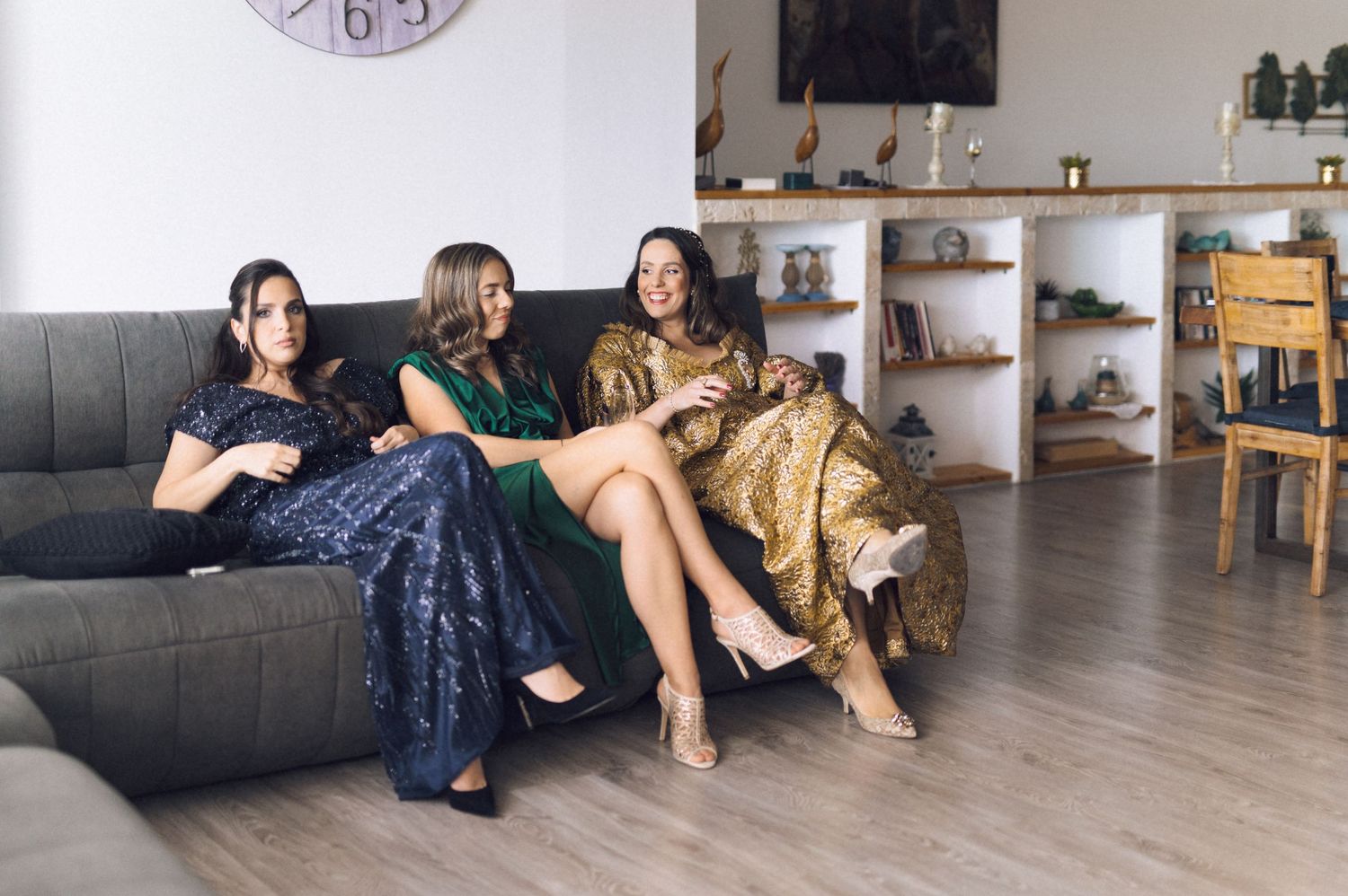 A sequence of photos showing people relaxing on a couch with a golden retriever dog in a modern living room.
