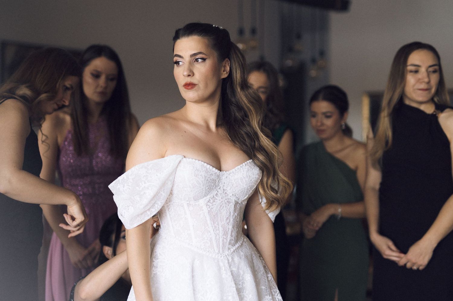 A series of fashion photos showing models in white and black dresses posing in a studio setting.