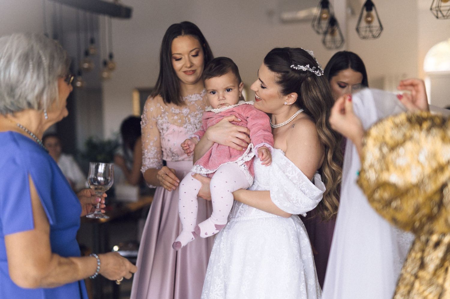 A collage of wedding preparation moments showing people in soft pink and white dresses getting ready for a celebration.