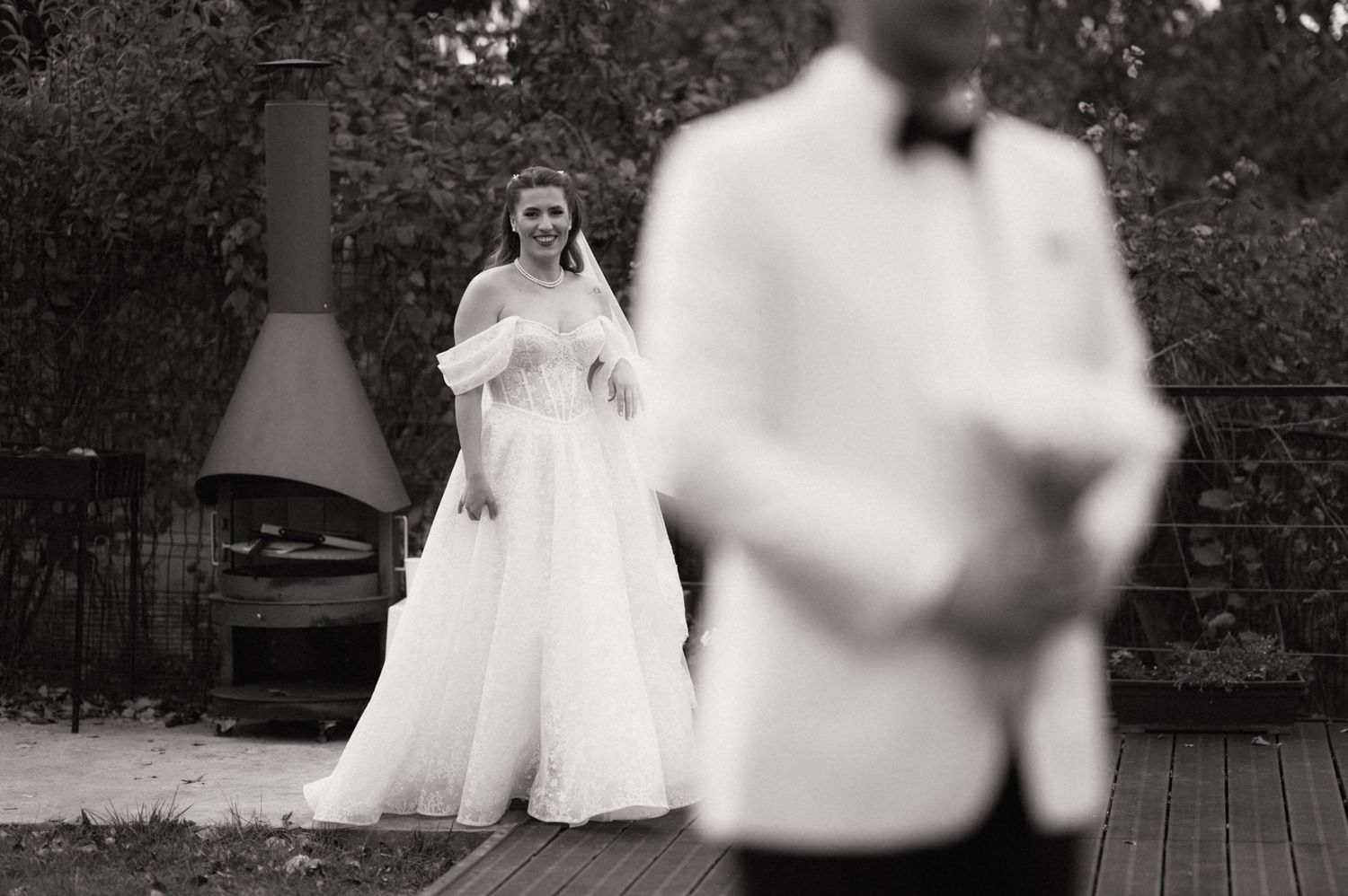 A series of black and white wedding photographs showing couples dancing and celebrating at an outdoor reception.