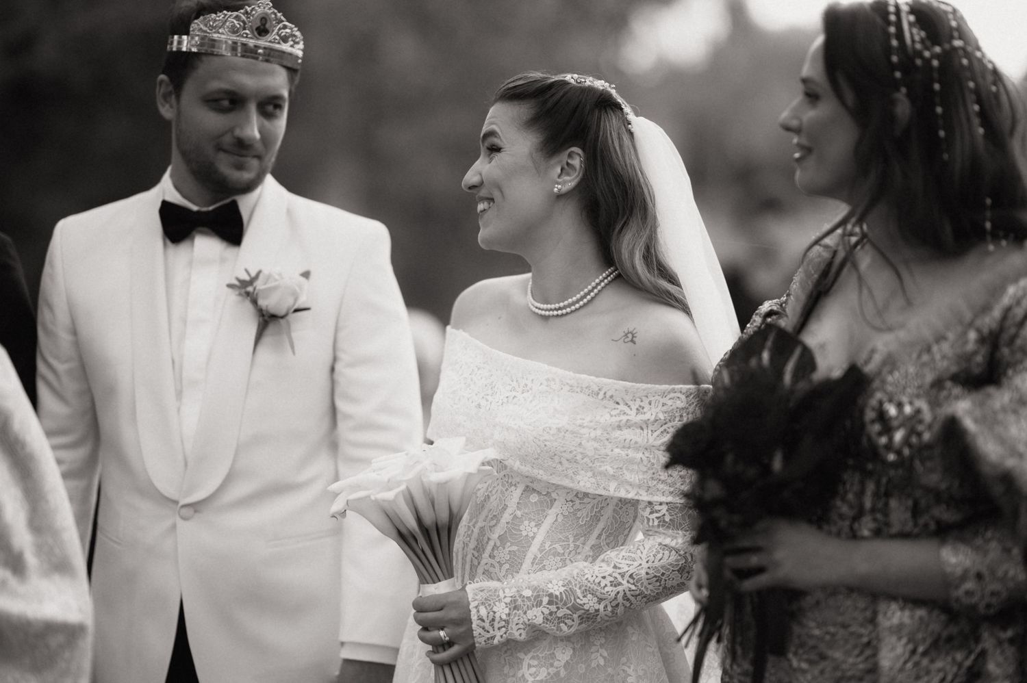 Black and white wedding photos showing couples sharing intimate moments during their celebration.