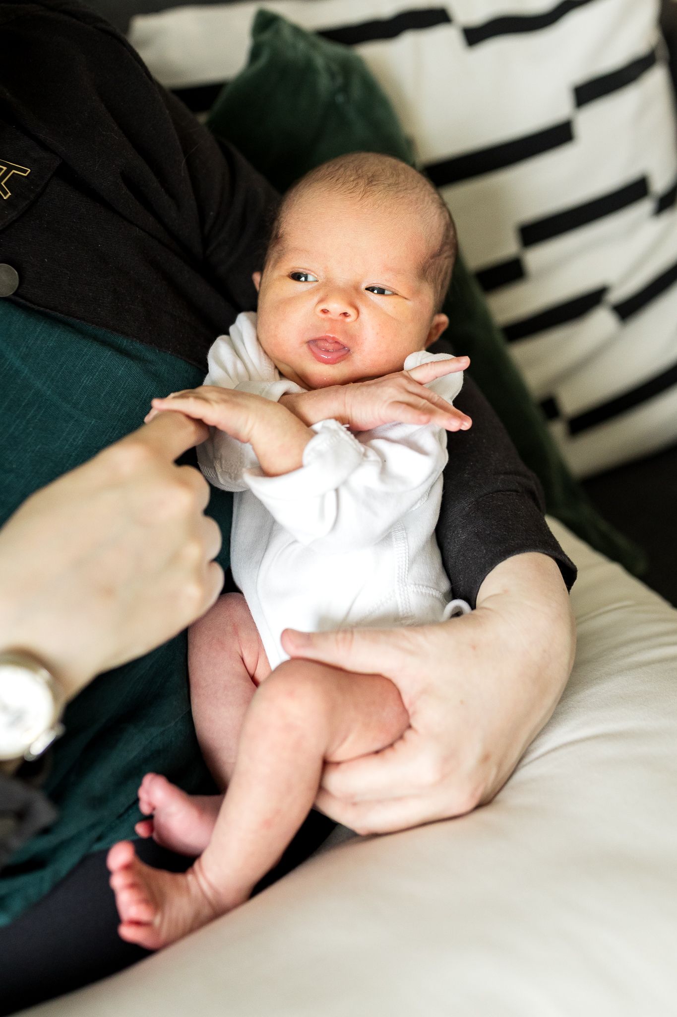 tiny baby girl in mum's arms