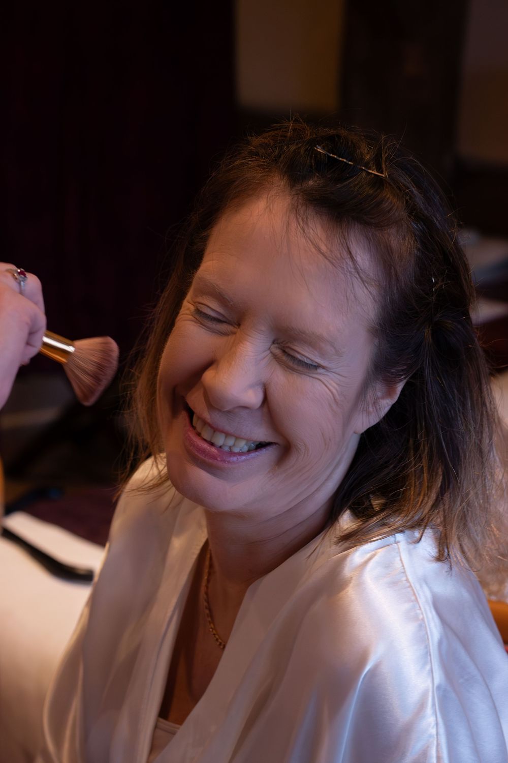 A sequence of photos shows someone in a white top smiling and laughing in different candid moments.