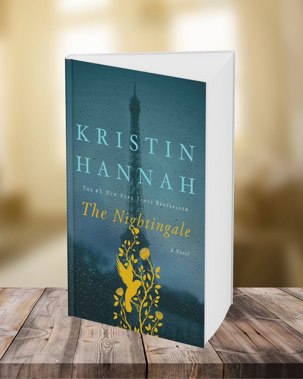 Multiple copies of the book 'The Nightingale' by Kristin Hannah arranged on a rustic wooden surface.