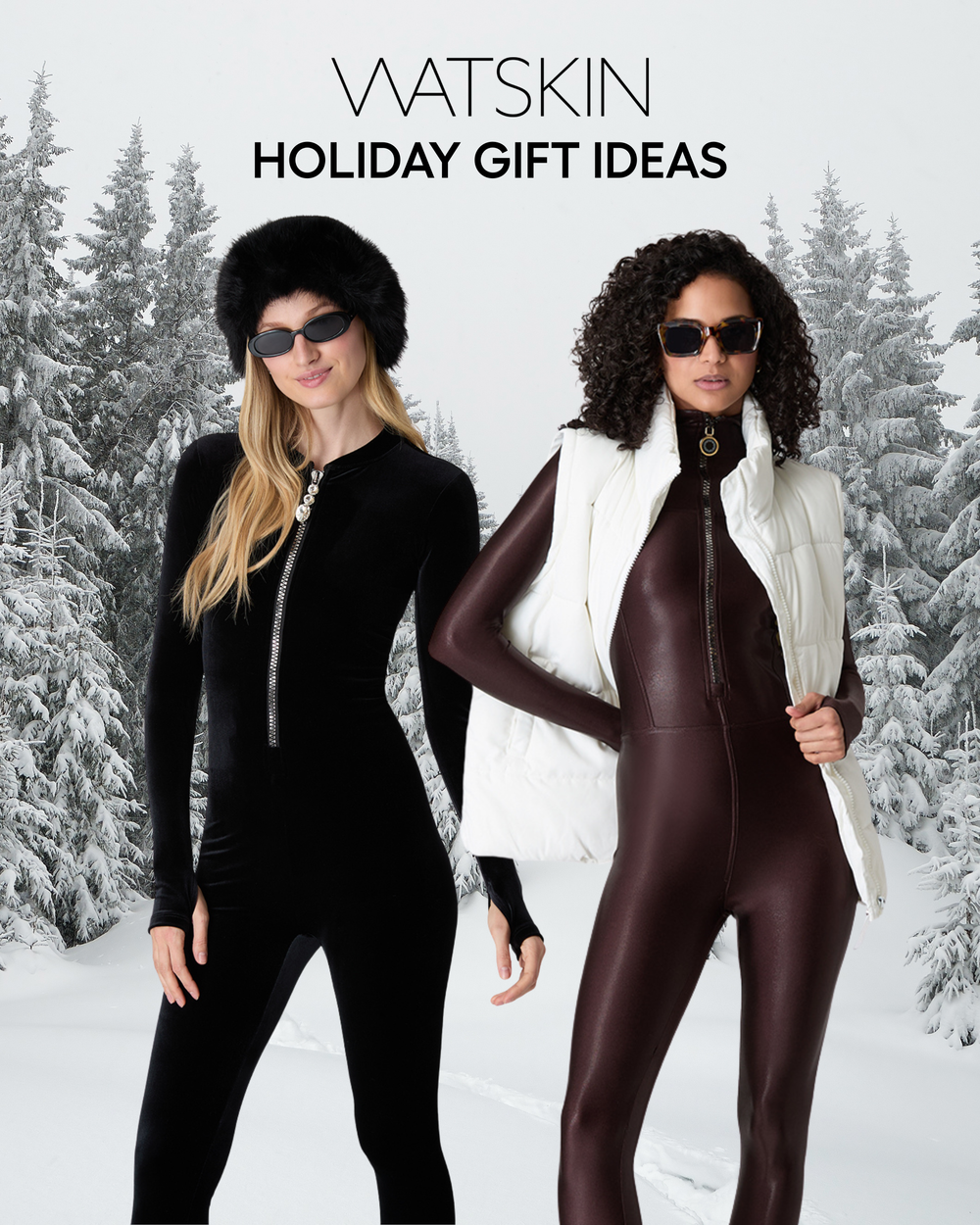 Two people pose in matching winter bodysuits against a snowy forest backdrop.