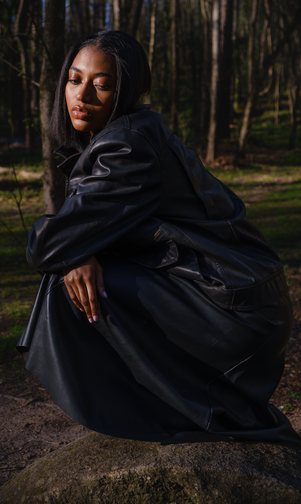 A figure in a flowing black cloak poses dramatically against a dark forest backdrop in a series of artistic shots.