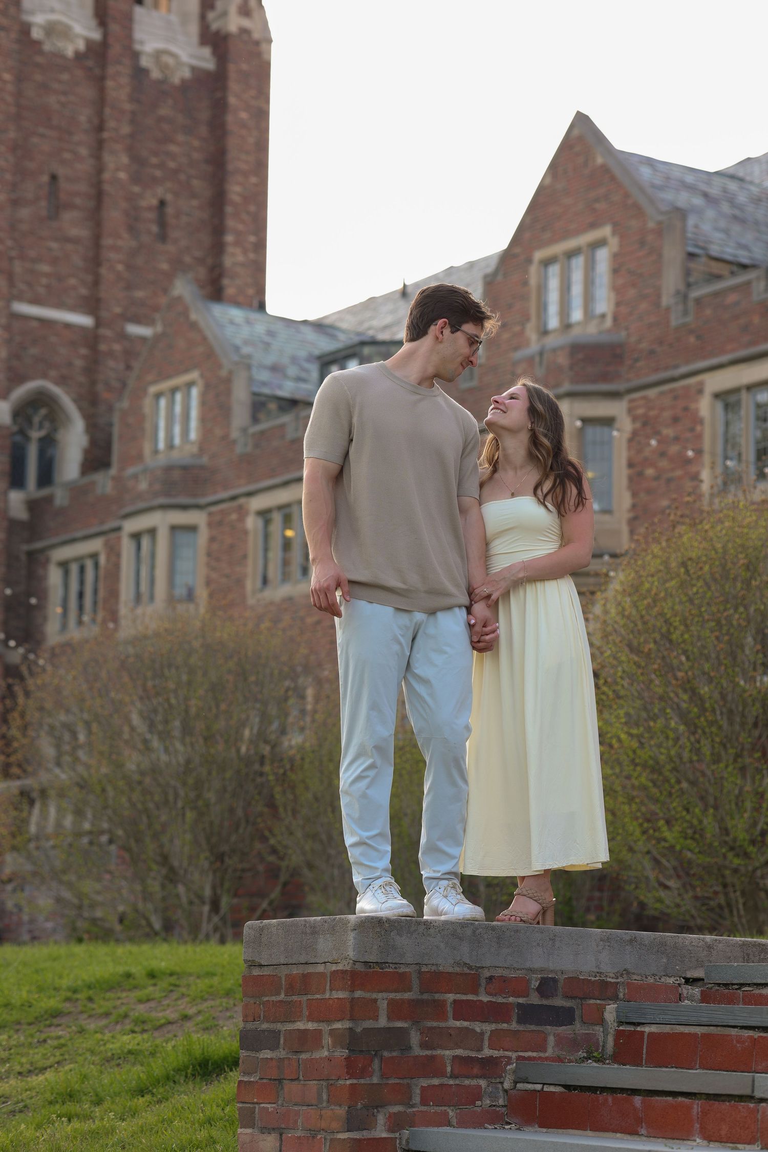 Man and woman looking at each other in front of building