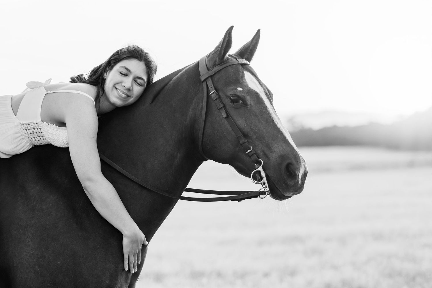 UC Davis graduate and polo player hug her horse captured by Northern California Equine Photographer Lauren Ann Photography