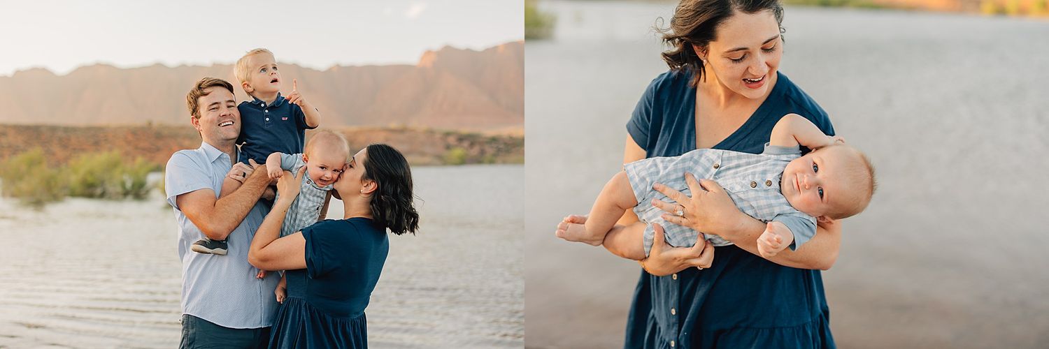 A family of three poses outdoors near water at golden hour, parents smiling as they hold their baby.