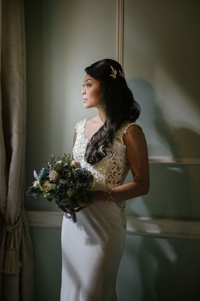 Elegant Asian bride preparing for her destination wedding overlooking Lake Garda, Italy