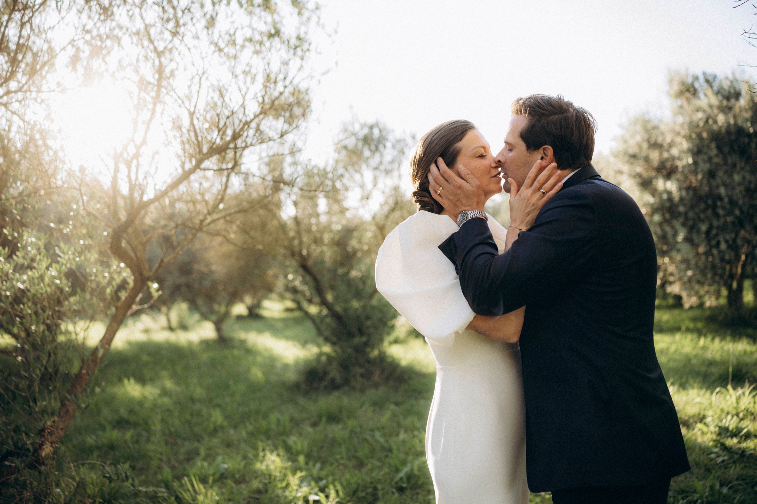 A romantic dance silhouette under stone archways with warm lighting.