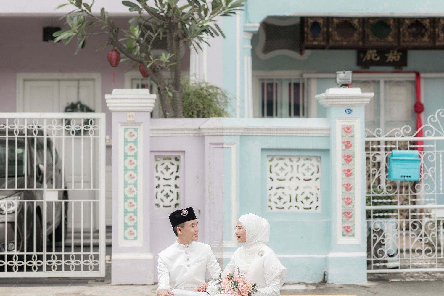 A romantic garden scene with white architectural elements and lush greenery.