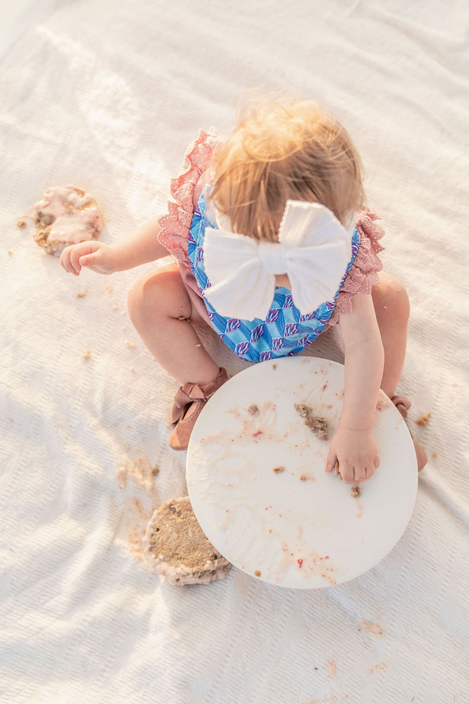 toddler girl cake smash one 1 year milestone outdoor photography, pink cake, conroe photographer