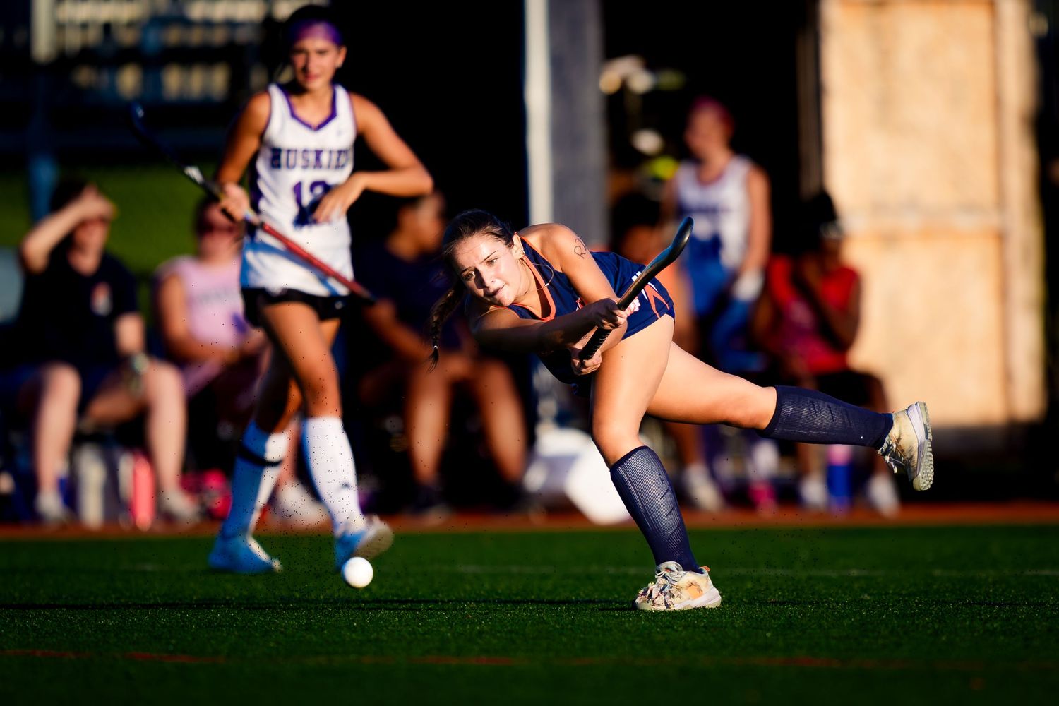 Hershey Trojans field hockey player follows through on a shot vs Mifflin County, by Deanna Fox, SportsFox Photography based in Hershey PA