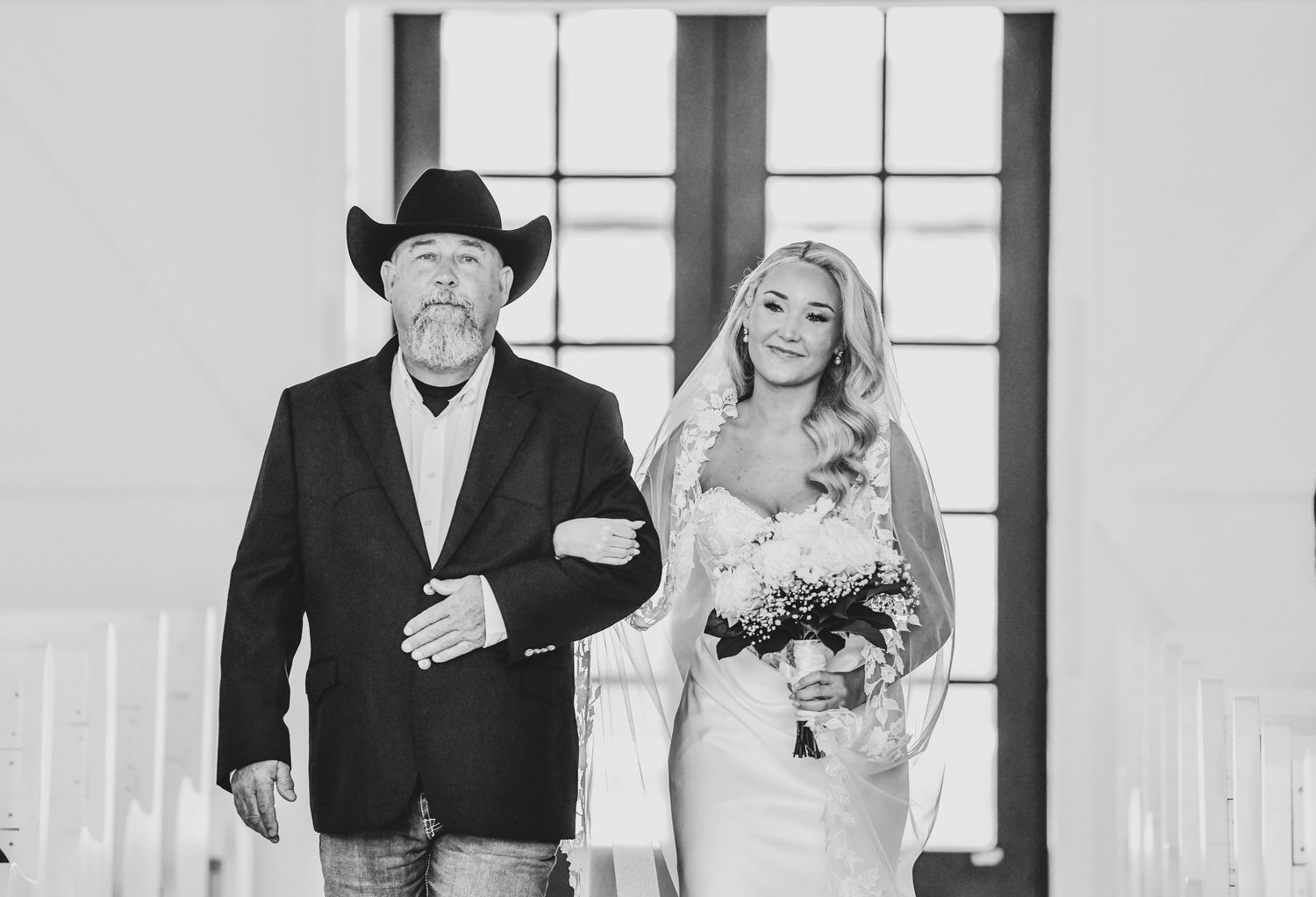 Emotional father daughter processional during wedding ceremony