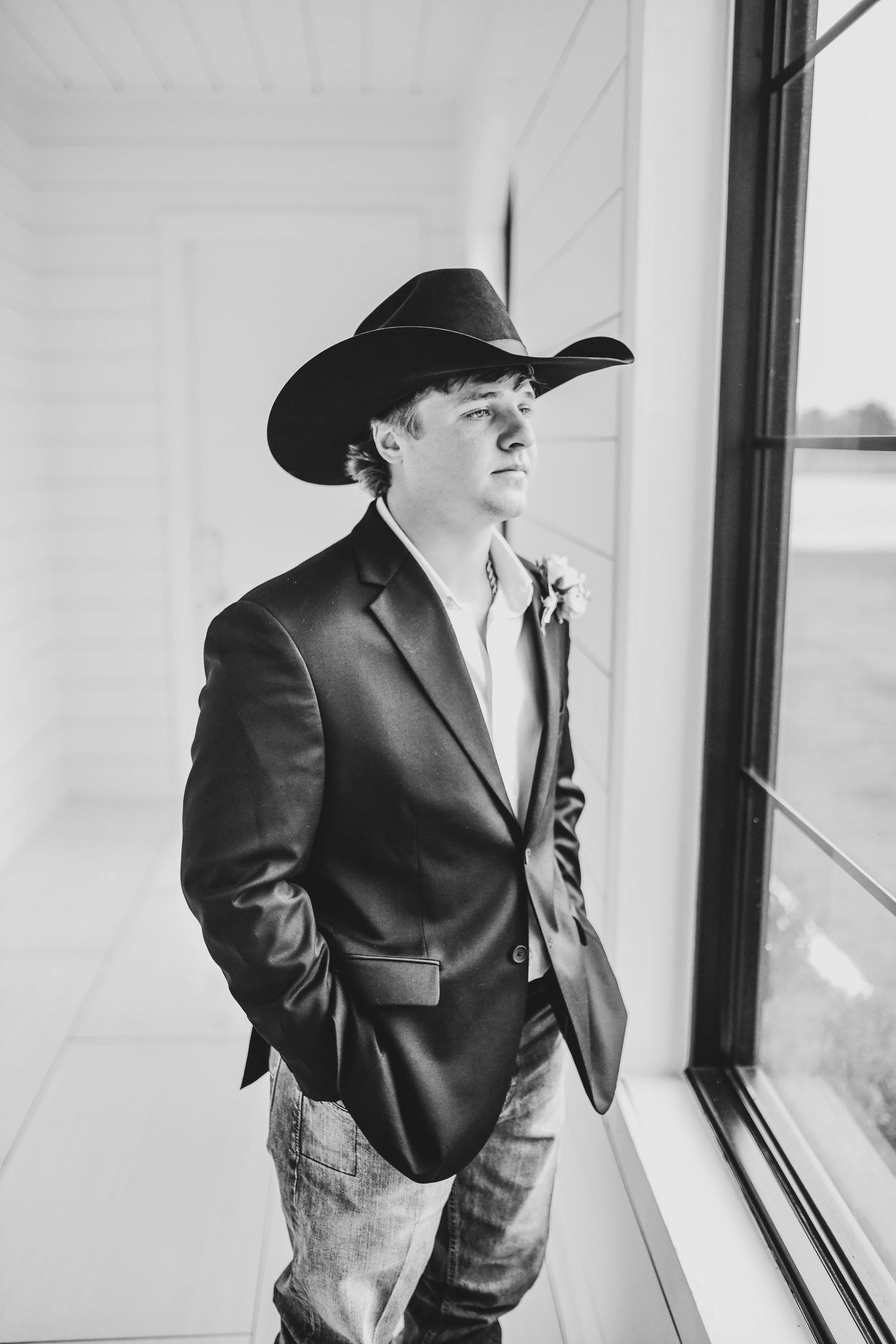 Groom preparing for wedding day in groom suite