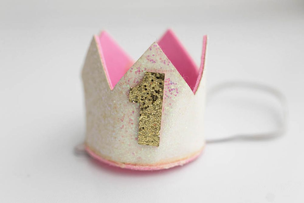 White and gold glitter birthday crown with number 1, infant 1st birthday photography in Temecula.