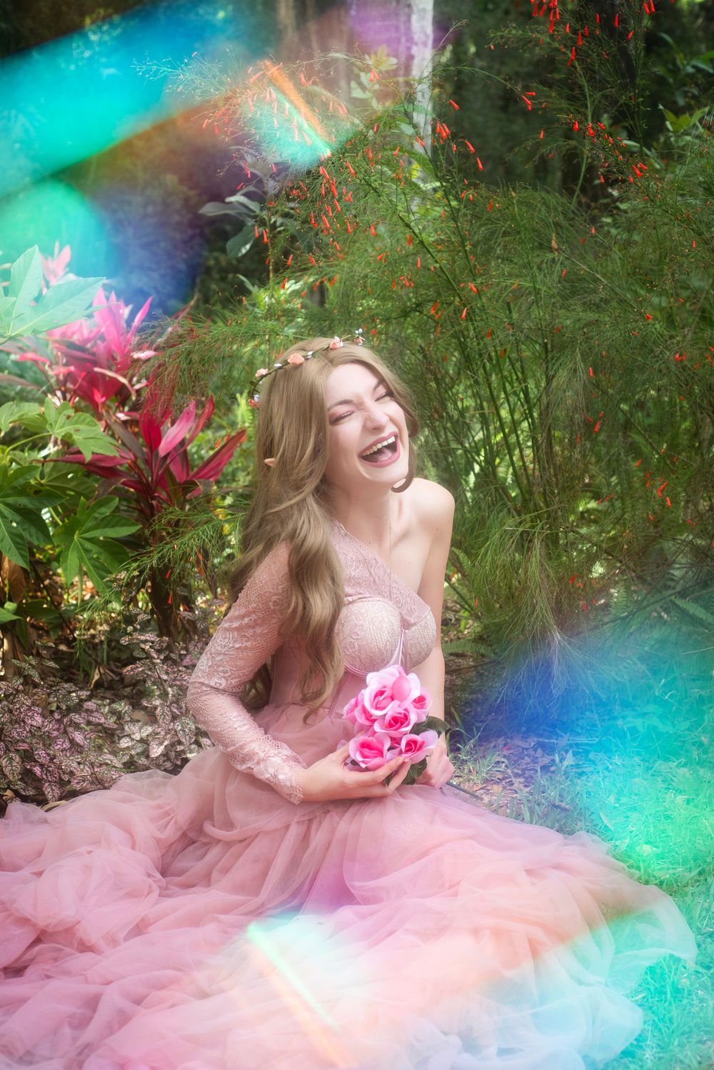 Solo outdoor cosplay session at Washington Oaks Garden of Elain Archeron from ACOTAR. Dynamic acting in floral garden