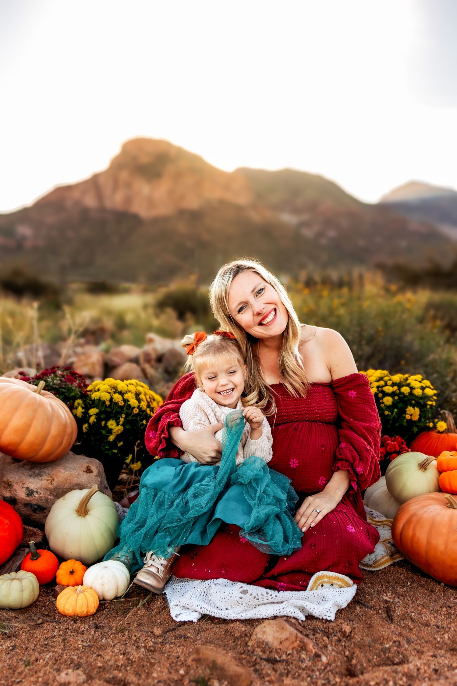 Clarksville TN family photographer capturing mother and children in warm golden hour light with earth tones and natural connection