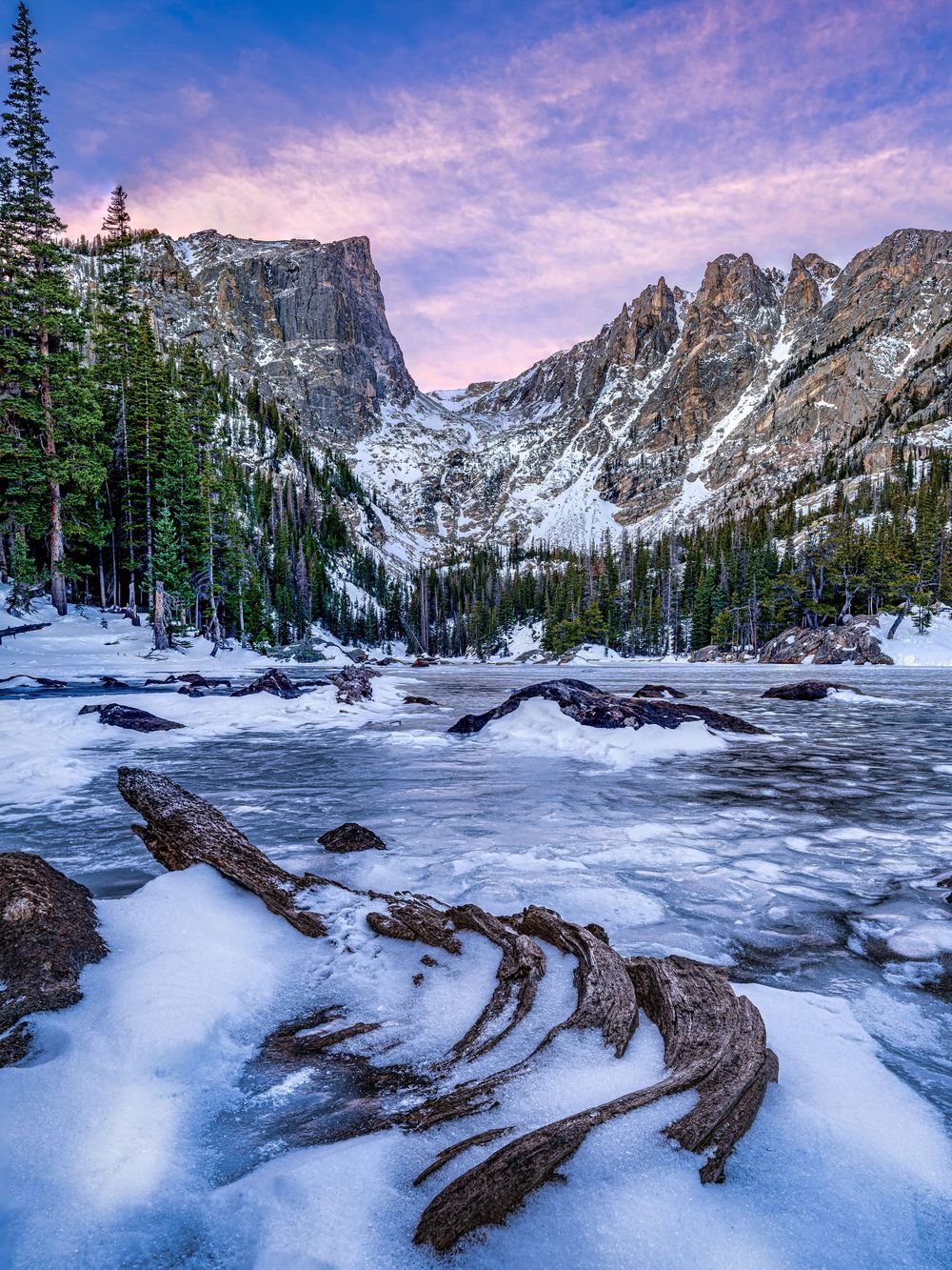 Sunrise shot of a frozen alpine lake by Denver Hospitality, Travel & Tourism photographer Captain Colorado Photography.