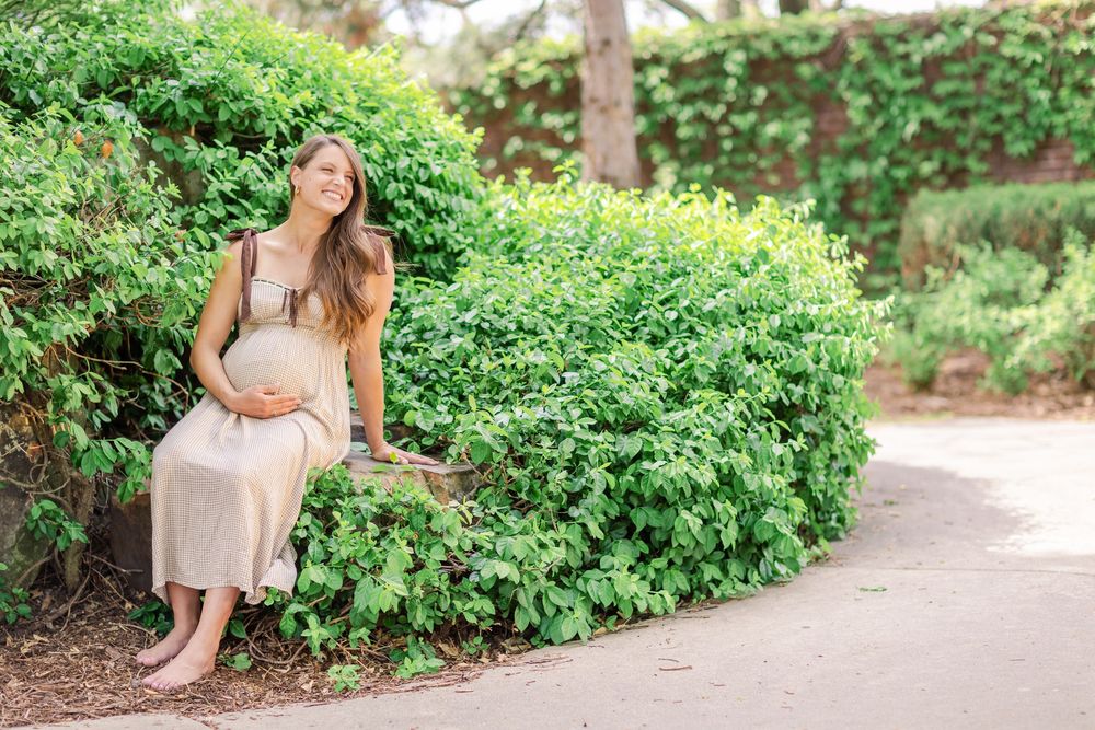 Soft, natural maternity portrait at Eastborough Park surrounded by fresh spring greens