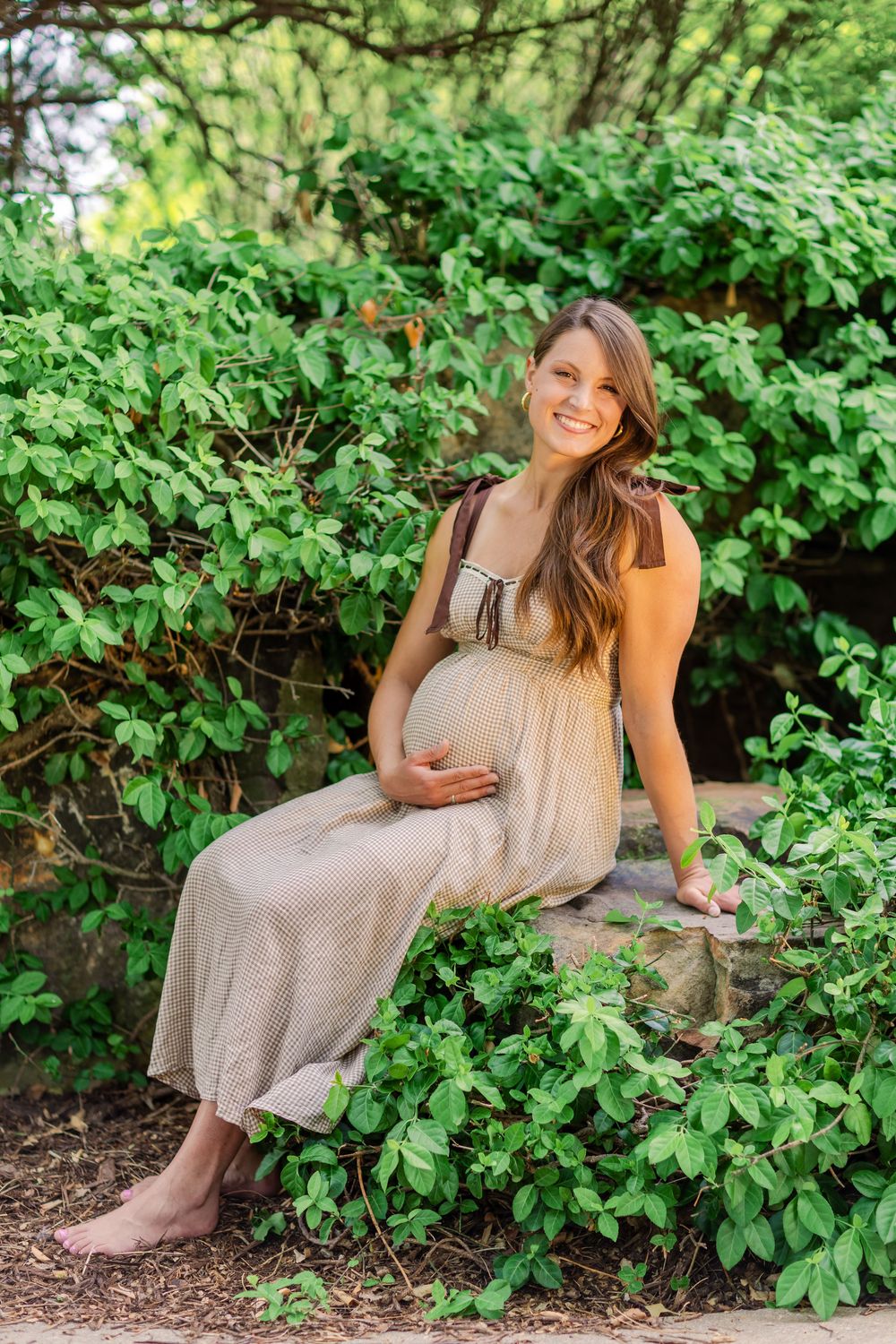 Mother soaking in the final weeks of pregnancy during a sunrise spring session