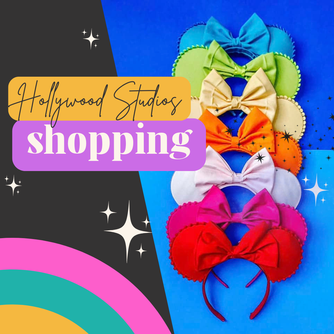 Colorful Minnie Mouse ear headbands arranged in rainbow order against blue and black background.