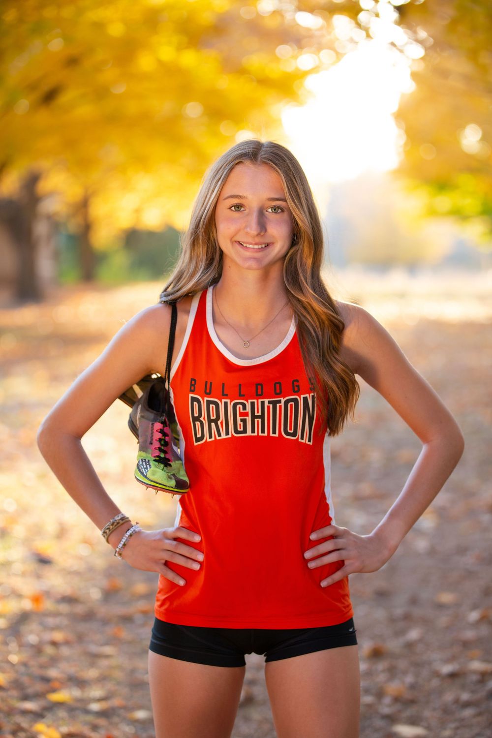 outdoor senior photos Brighton Michigan Hudson Mills Metropark track & field senior girl portrait natural light