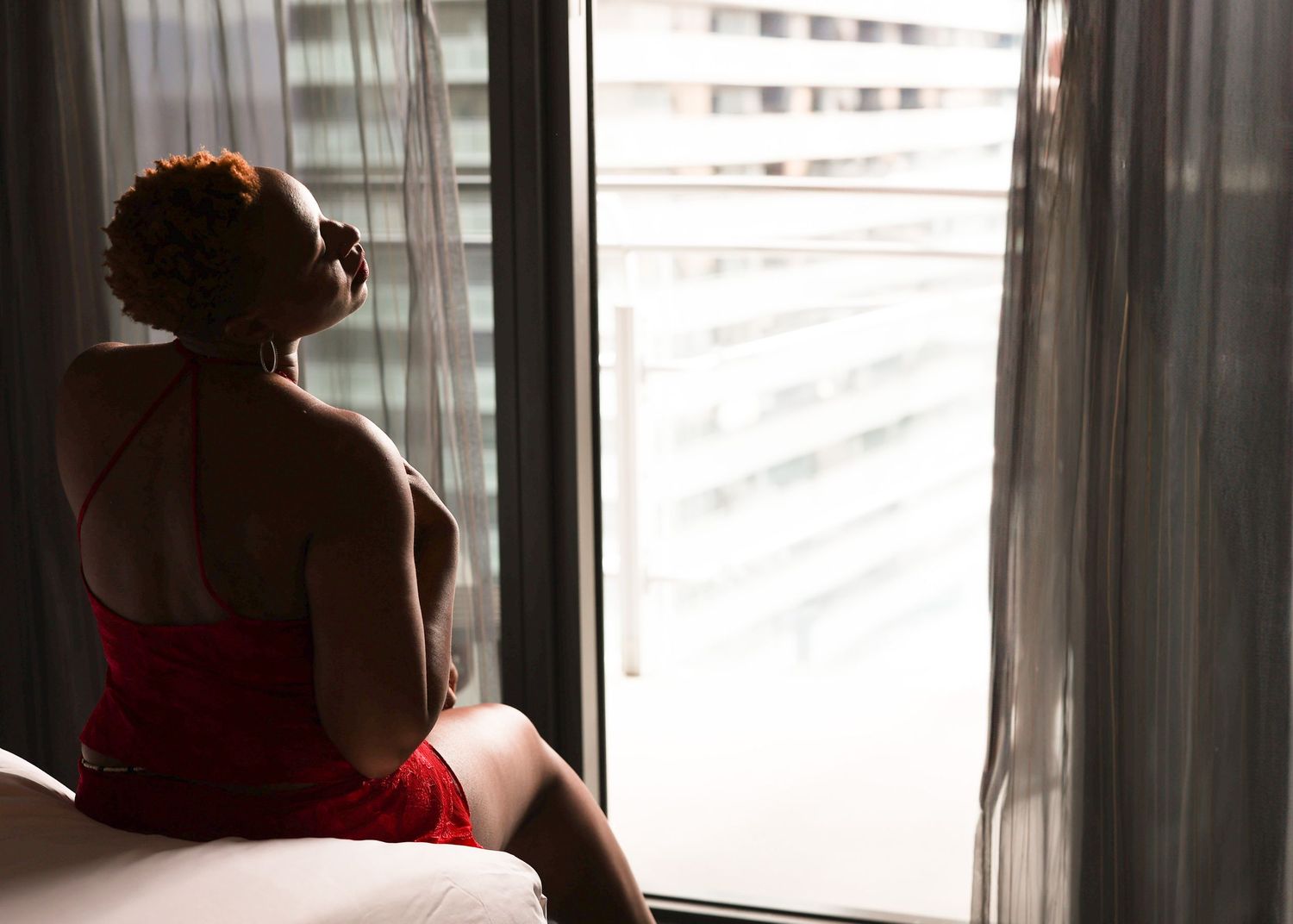 Intimate lifestyle portrait of a woman sitting on an bed, Baltimore As I Am session