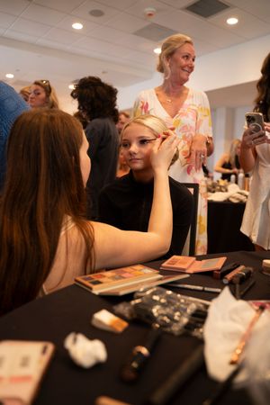 Guest seated at tables during an indoor event at the Azalea spring fashion show at holiday day inn resort located in Wrightsville beach