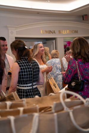 Guest mingle in the elegant ballroom during the 2026 North Carolina Azalea Festival Spring Fashion Show