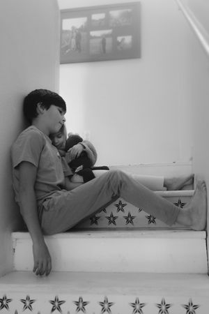 A sequence of photos showing someone resting on a white bench with decorative stars along the edge.
