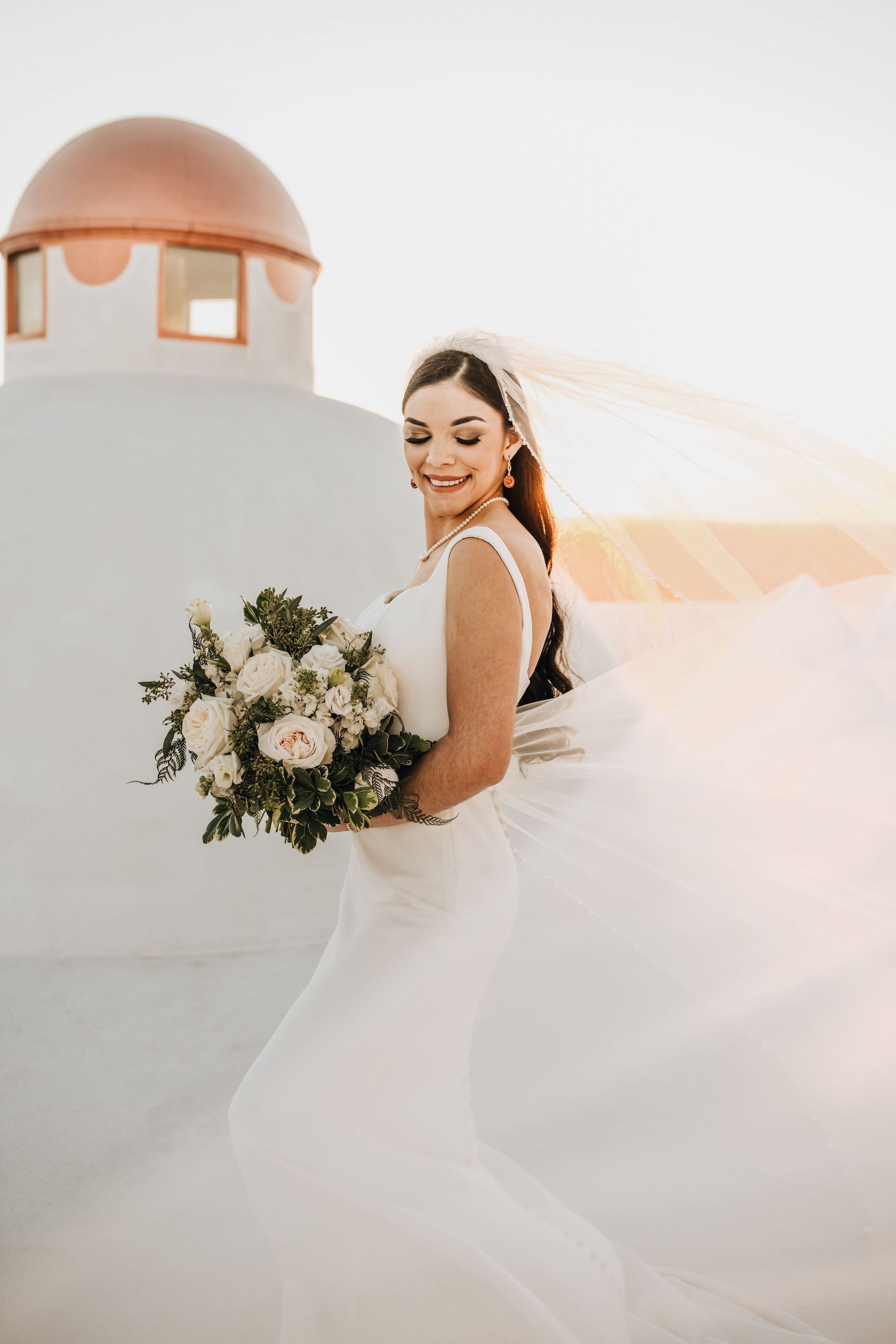 Bride with flowing veil at Stoney Ridge Villa during sunset bridal session in Texas