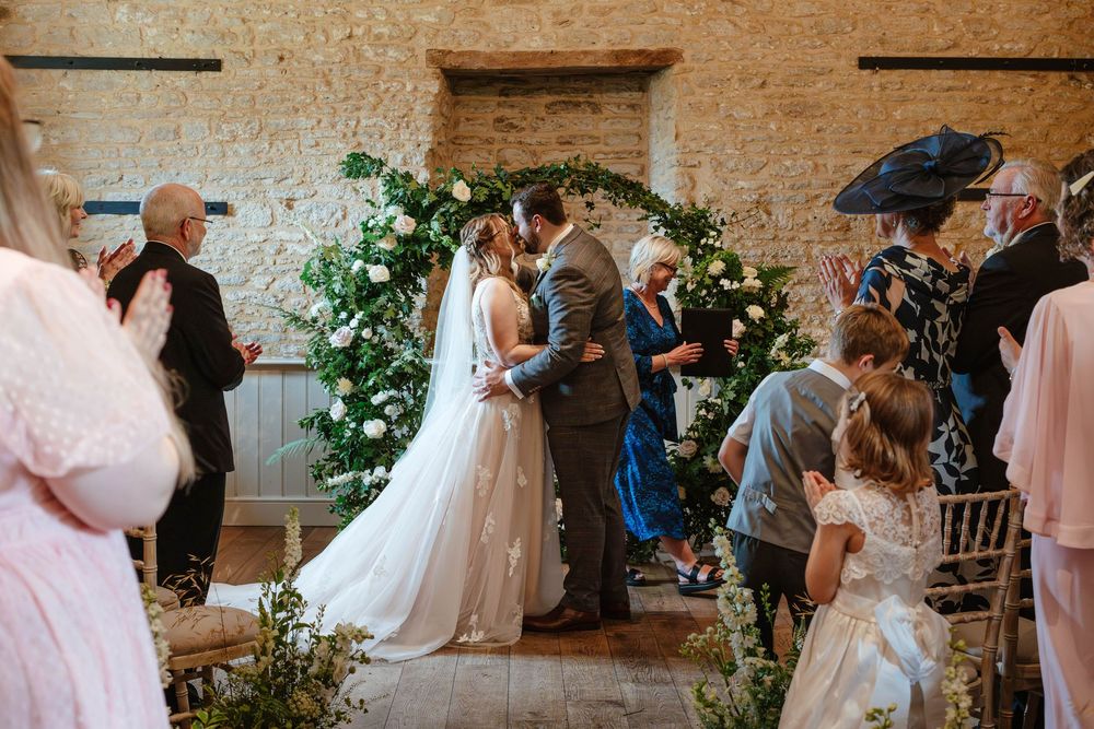 Bath Wedding Photographer Zara Davis Photography Cotswolds Wick Farm Bath first kiss for bride and groom