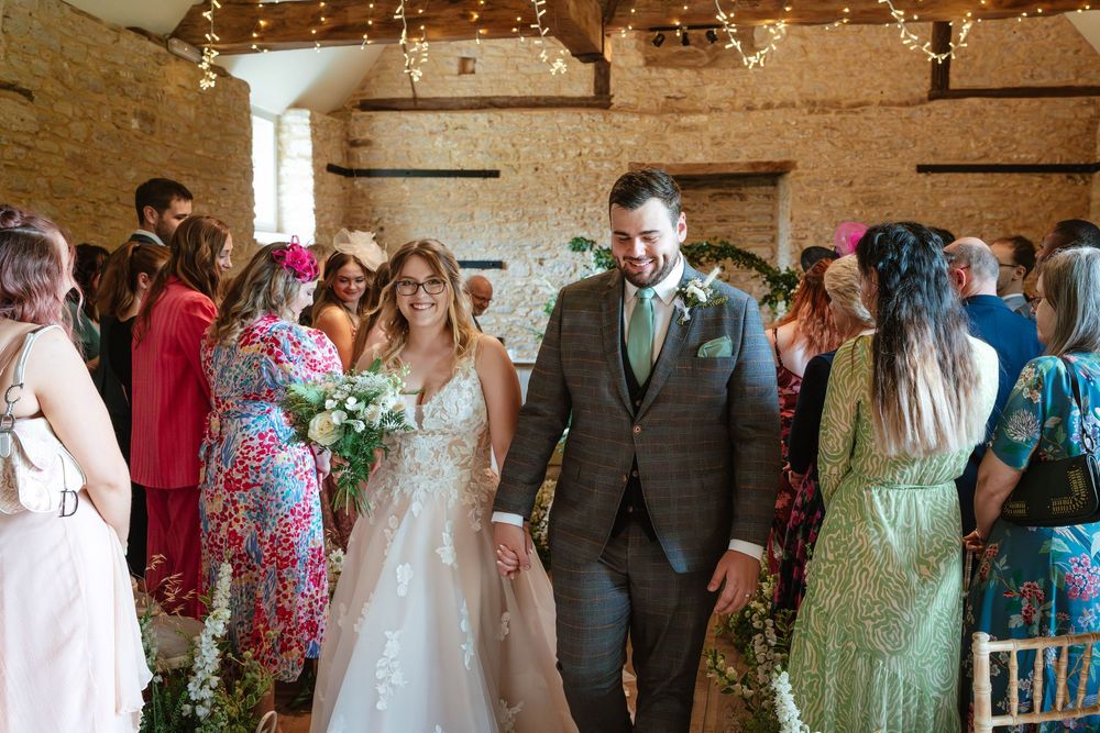 Bath Wedding Photographer Zara Davis Photography Cotswolds Wick Farm Bath bride and groom walking back down the aisle