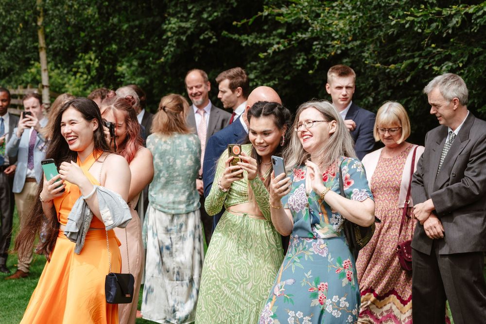 Bath Wedding Photographer Zara Davis Photography Cotswolds Wick Farm Bath  guests mingling during drinks reception