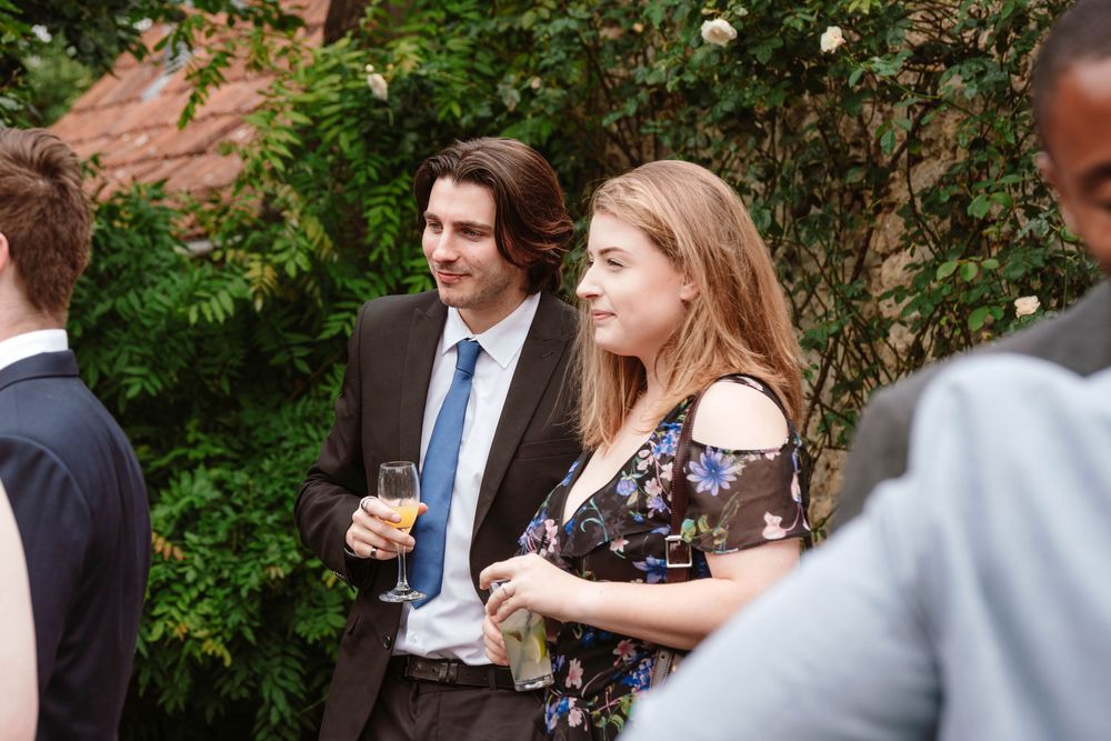 Bath Wedding Photographer Zara Davis Photography Cotswolds Wick Farm Bath guests having photo taken