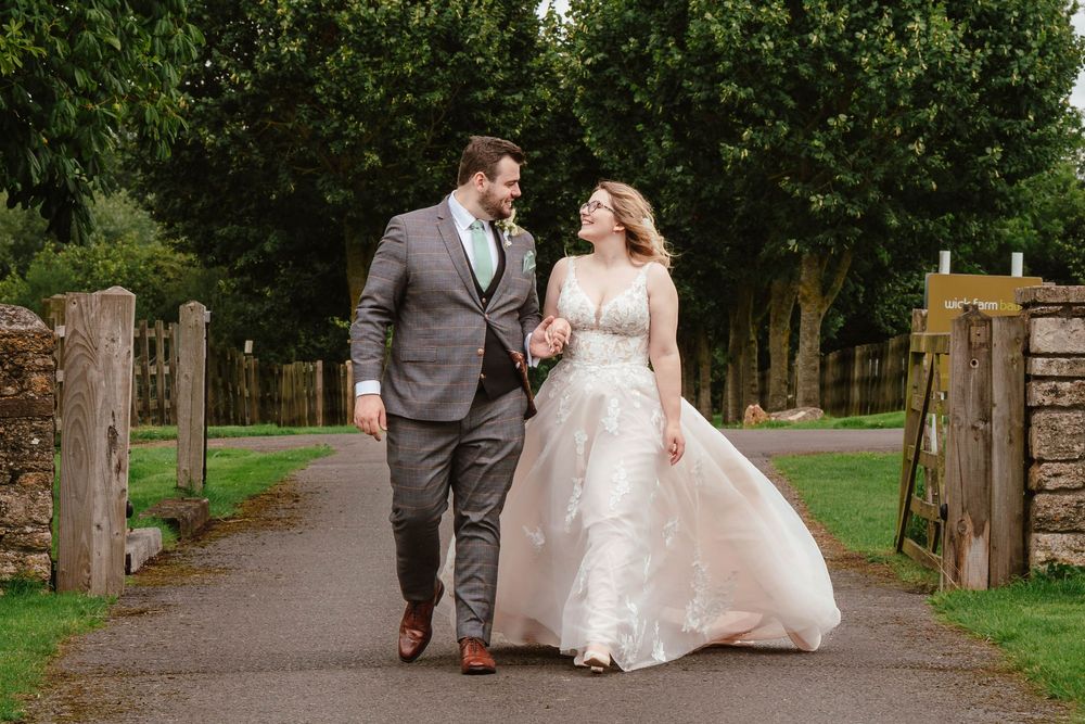 Bath Wedding Photographer Zara Davis Photography Cotswolds Wick Farm Bath bride and groom walking on driveway