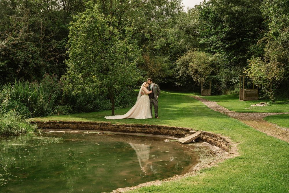Bath Wedding Photographer Zara Davis Photography Cotswolds Wick Farm Bath bride and groom by the pond