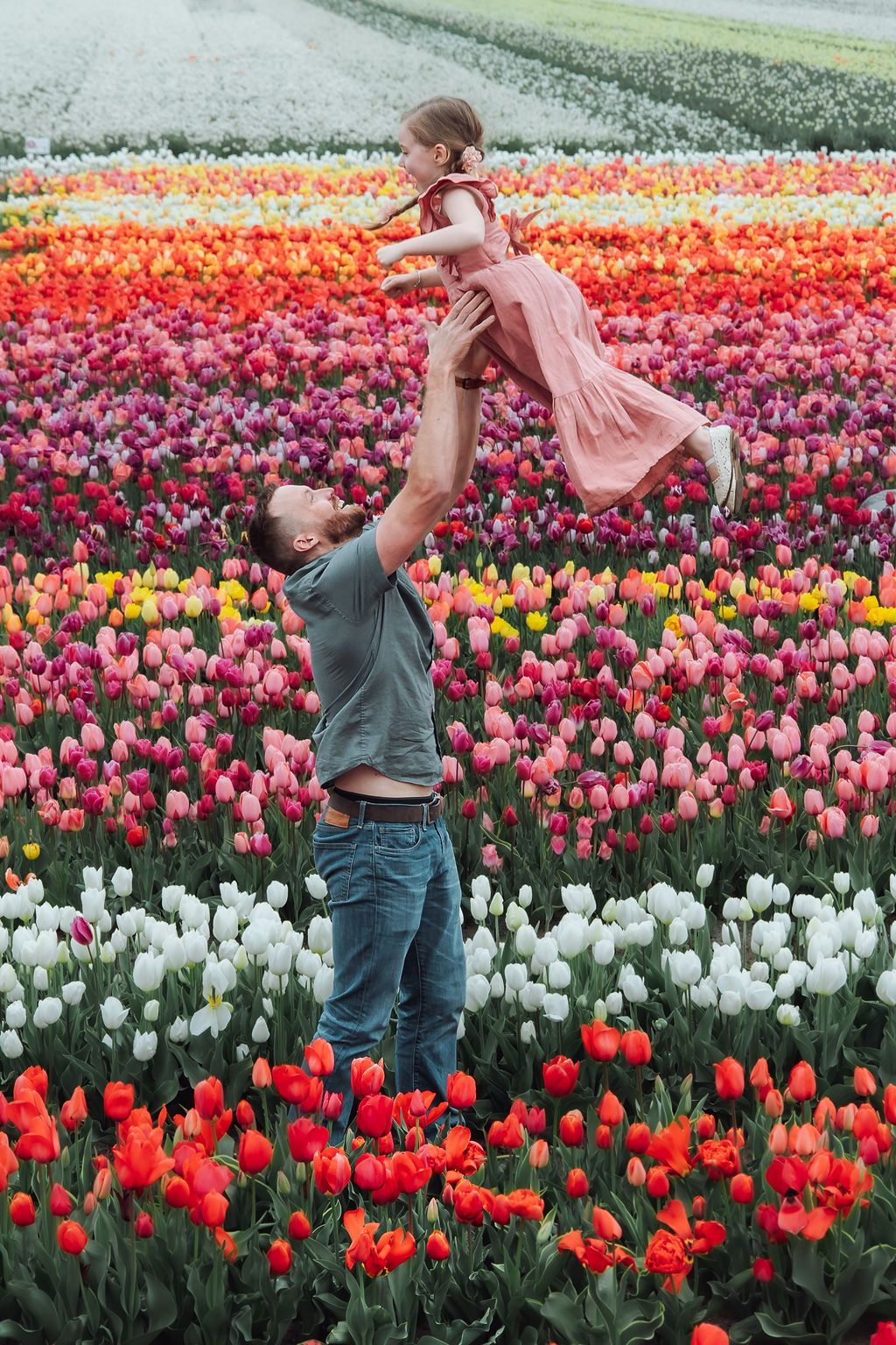 Father - daughter photoshoot in a tulip flower field in the Netherlands on a cloudy spring day at The Tulip Barn, Jorietha Rabie Photography