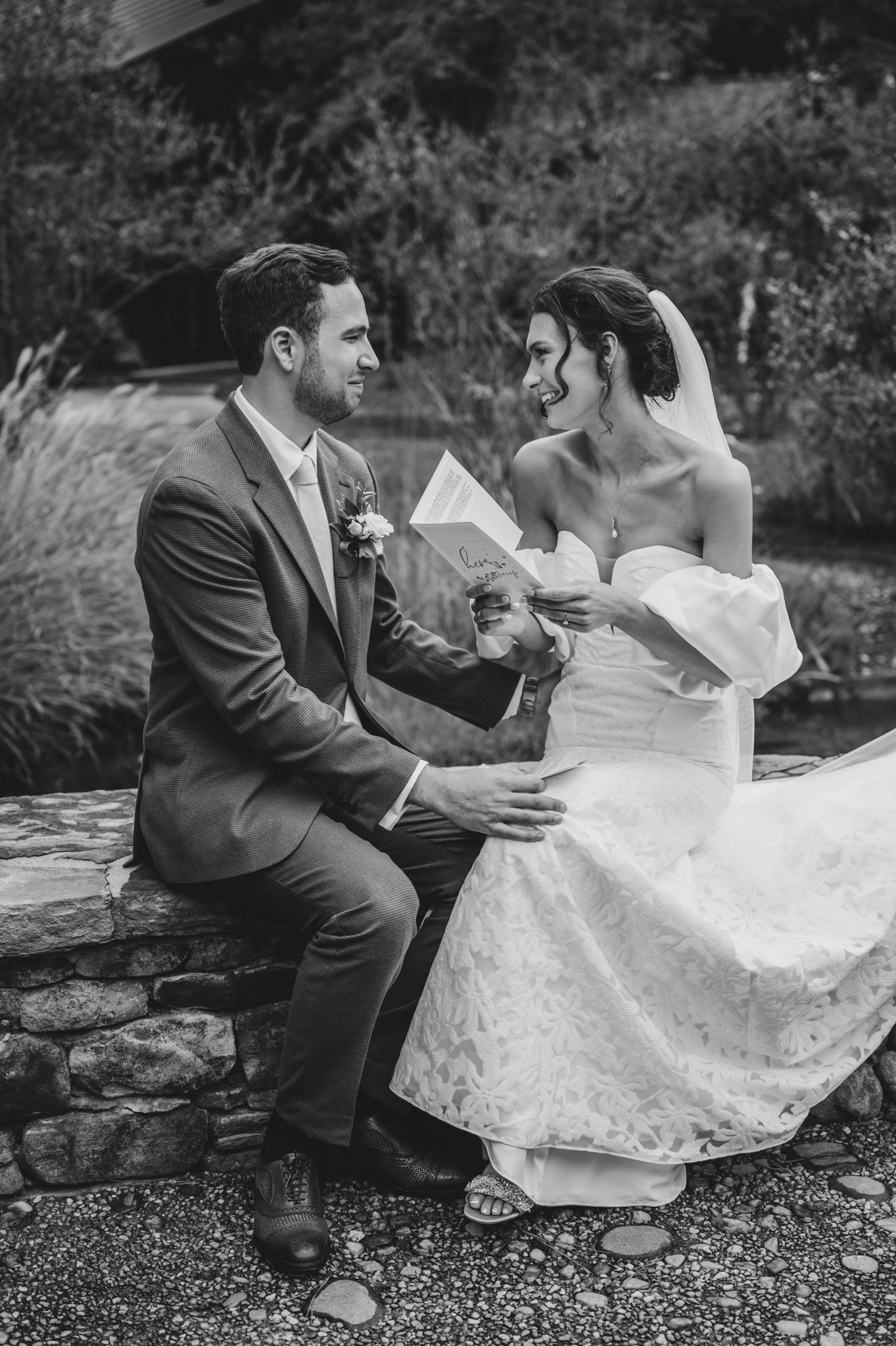 A romantic black and white wedding photoshoot sequence shows a couple sitting together on stone steps outdoors.