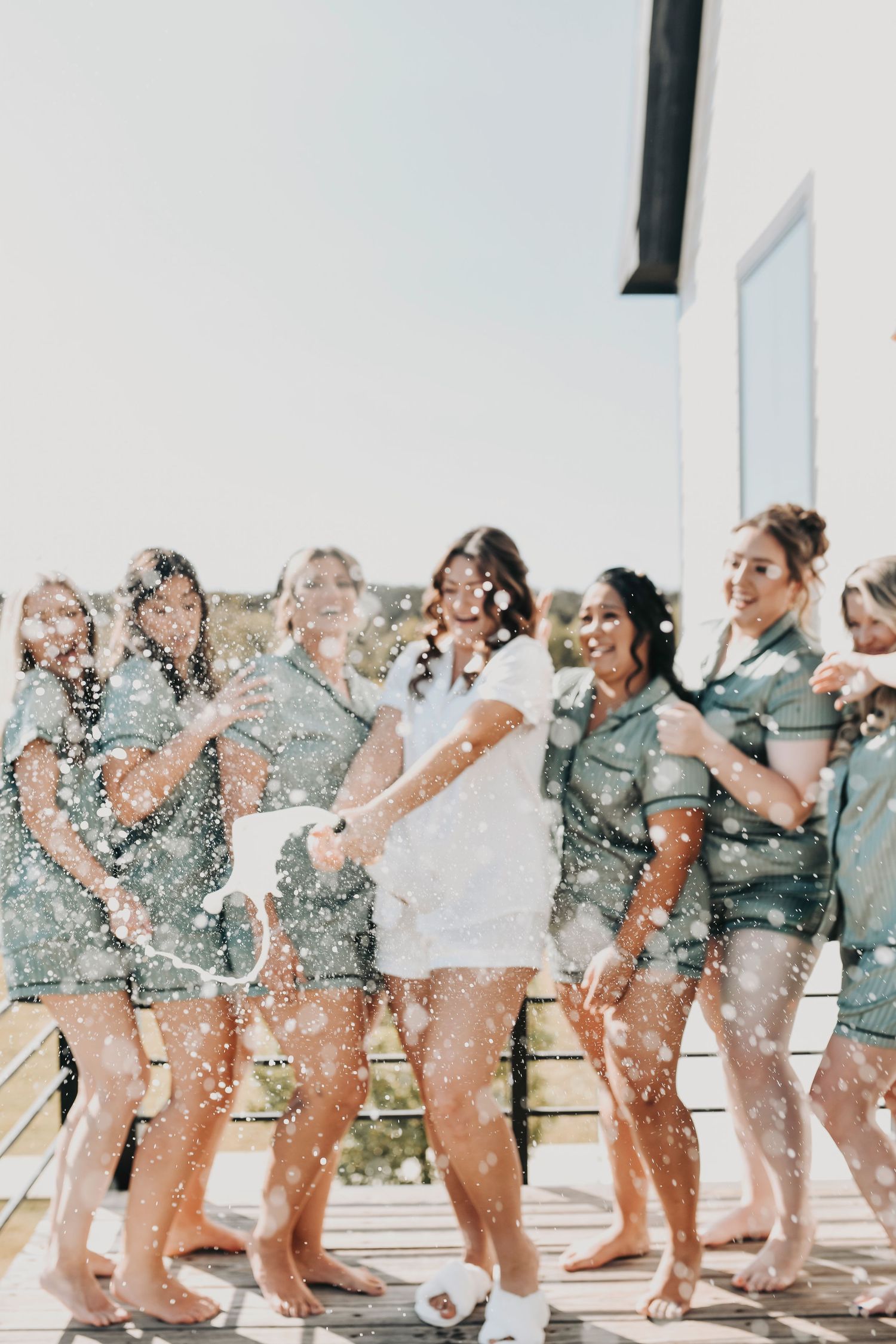 bridal party fun at rustic wedding venue