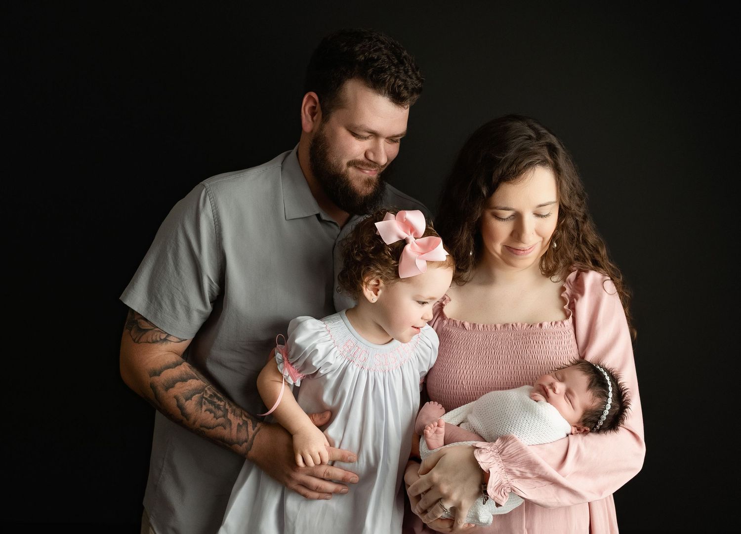 The entire family is looking so lovingly at their newborn baby girl. Greenville SC newborn Photographer - Easley SC newborn Photographer