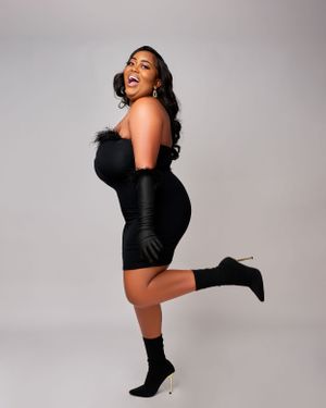 lady in a black dress and black gloves
