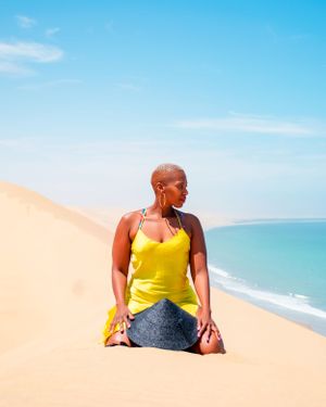 lady seating on the dunes