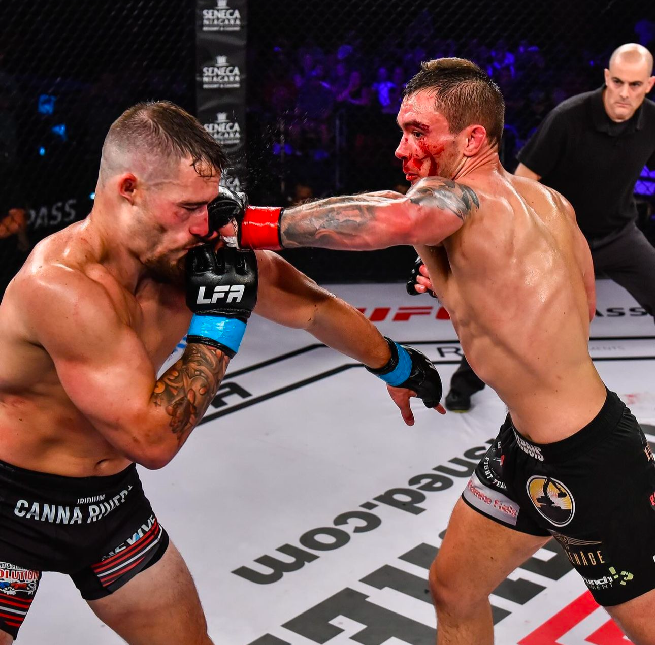 Two MMA fighters exchange powerful strikes during an intense mixed martial arts bout in an octagon cage.