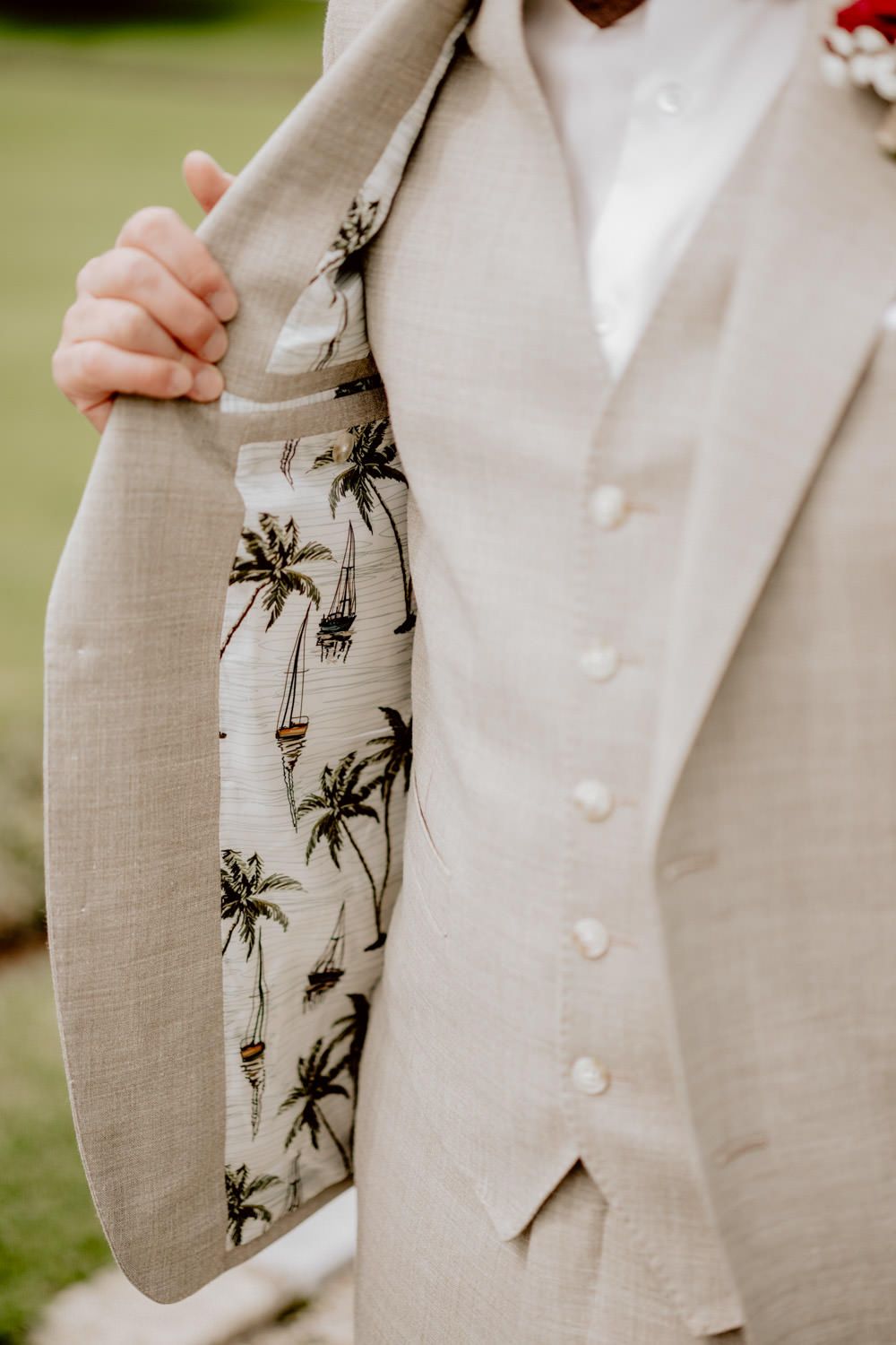 Beige suit jacket with fun palm tree printed lining detail.