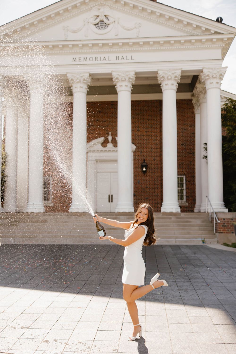 University of Kentucky grad session with champagne pop