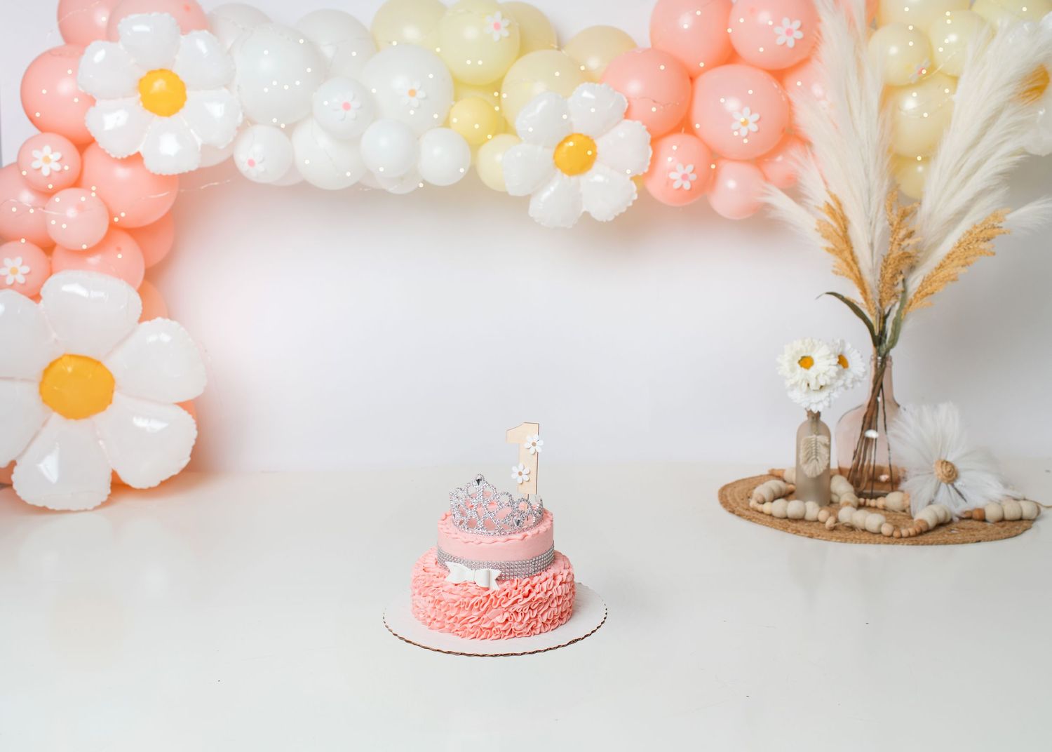 Boho peach and cream first birthday cake smash setup with neutral balloons in Linden, New Jersey.